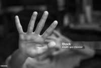 Boy showing STOP gesture with his hand. Concept of domestic violence and child abuse. Copy space